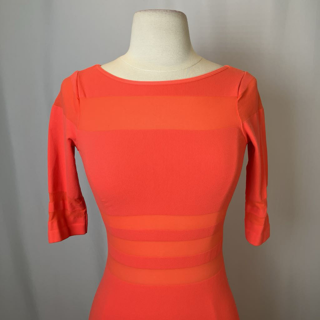 Red dress on a mannequin against a gray background