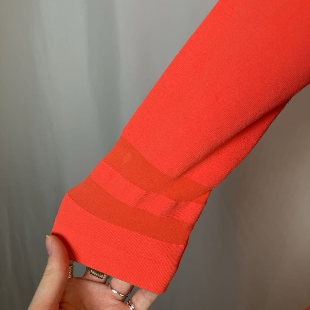 Close-up of a red sleeve with a blurred background