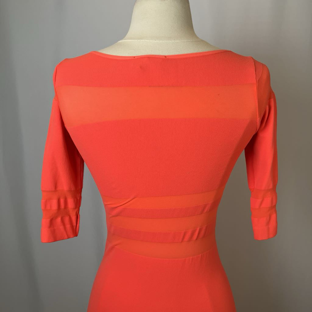 Red dress on a mannequin against a gray background