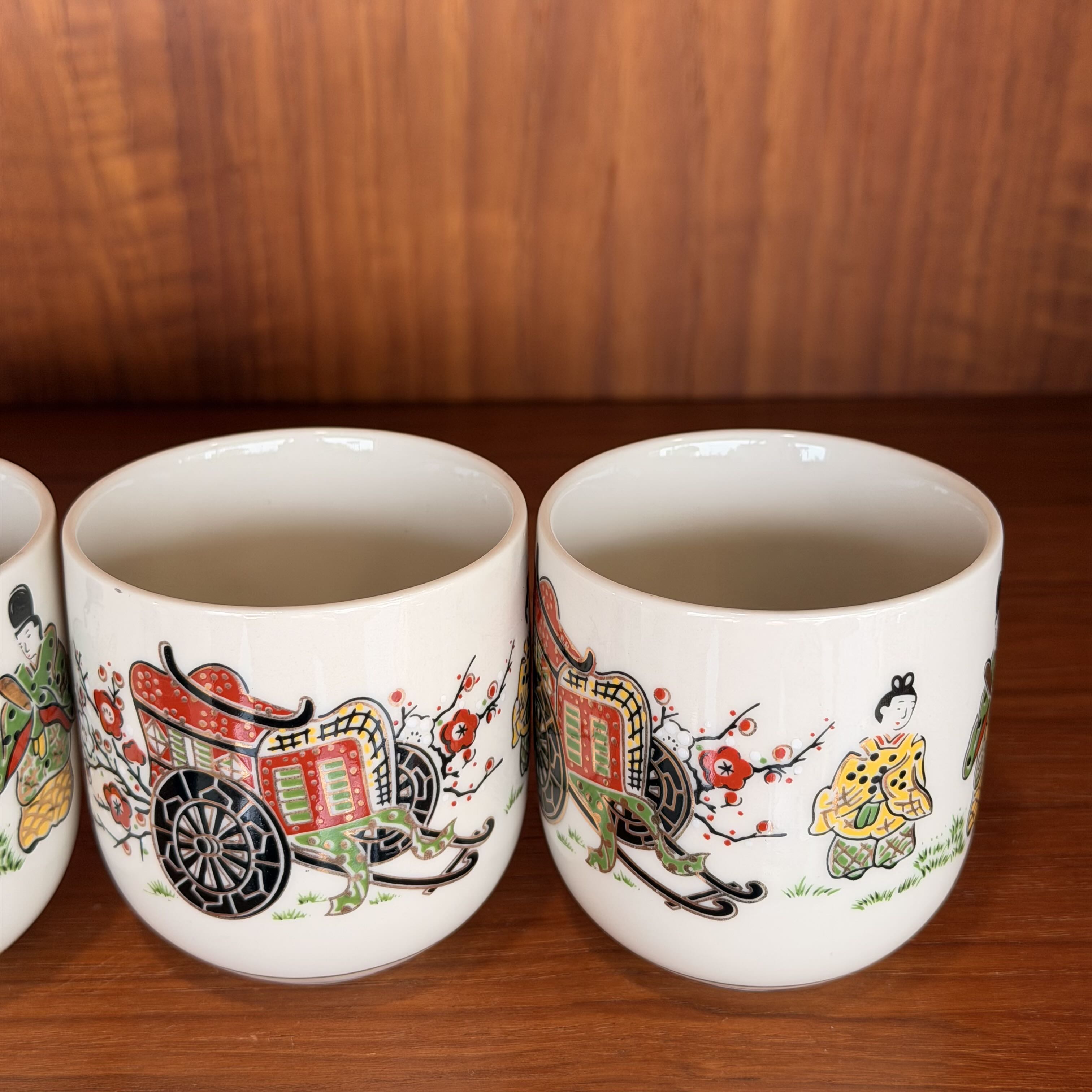 close up of two Vintage Japanese Tea Ceremony Cups against a wooden background