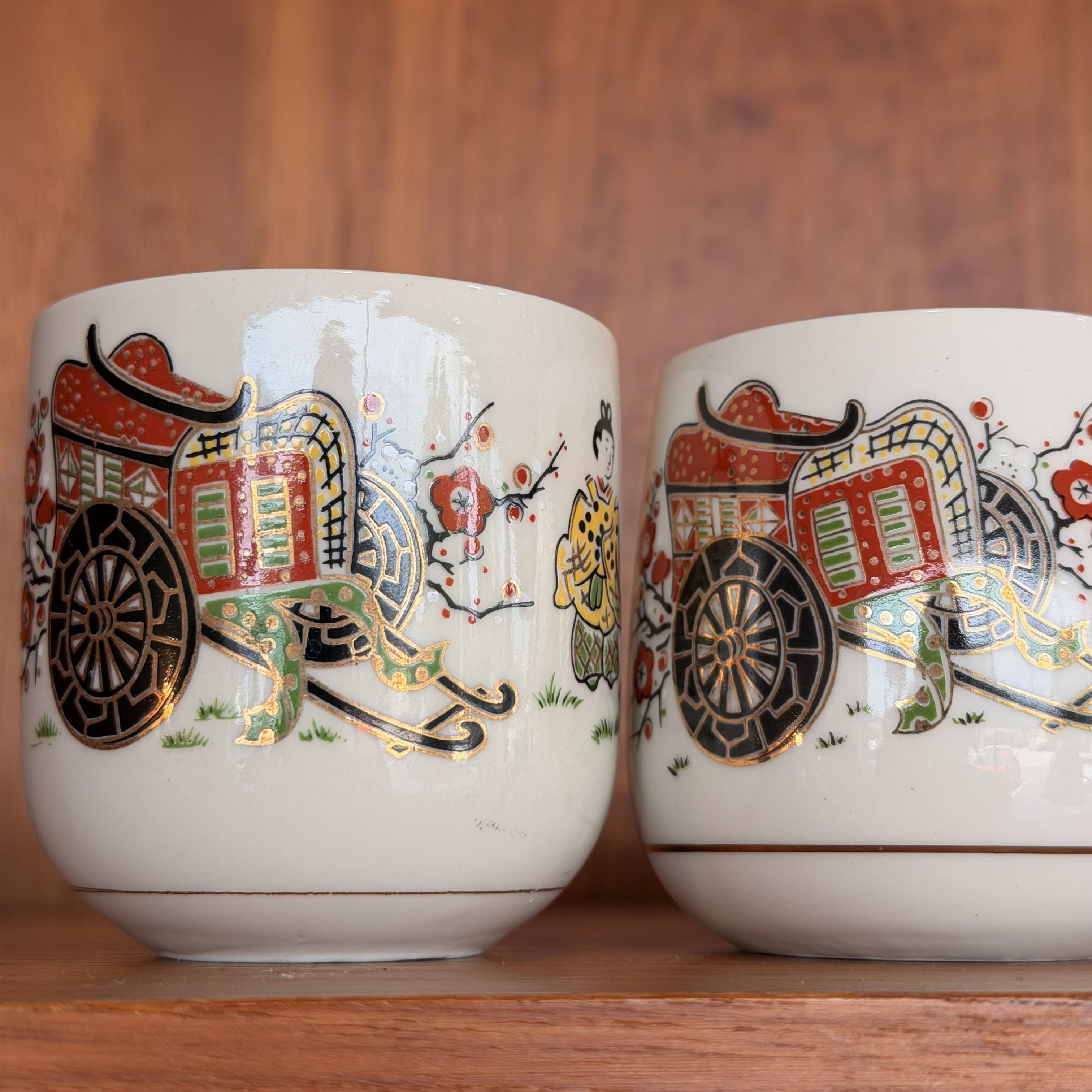 close up of Vintage Japanese Tea Ceremony Cups against a wooden background