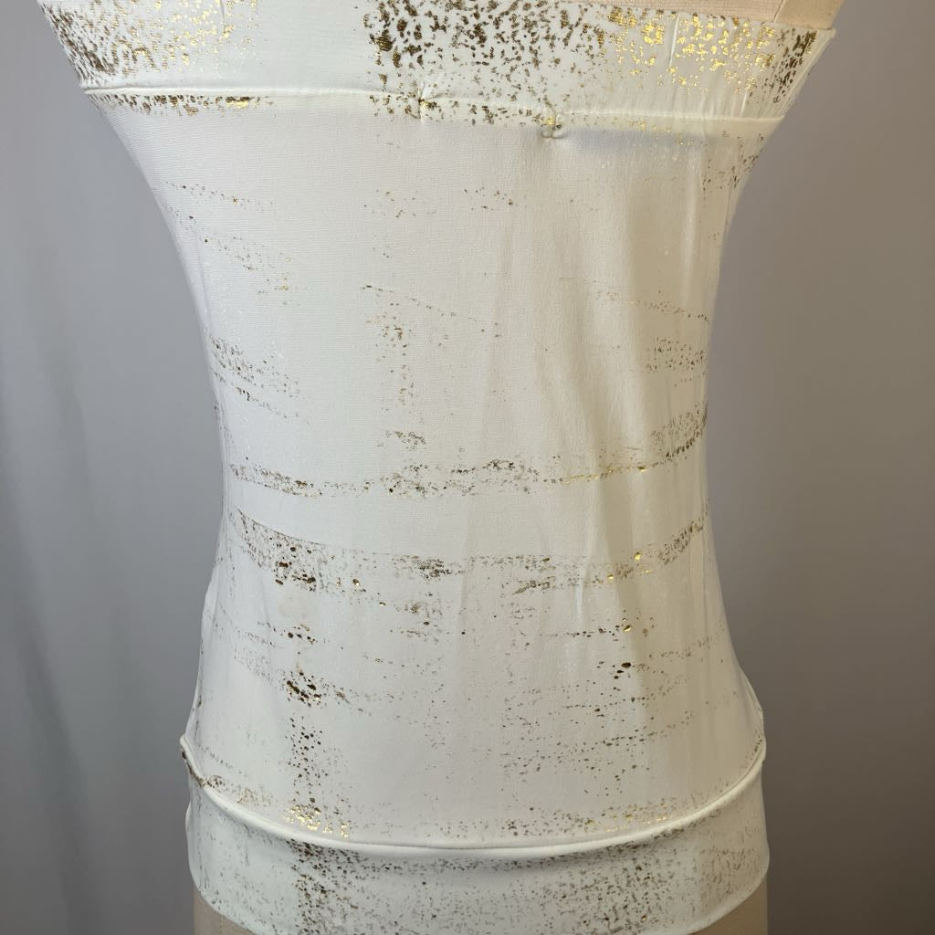 White textured dress with gold accents on a gray background