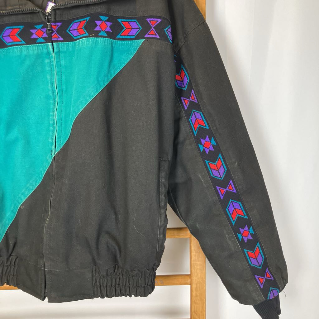 Black jacket with colorful geometric patterns on a white background