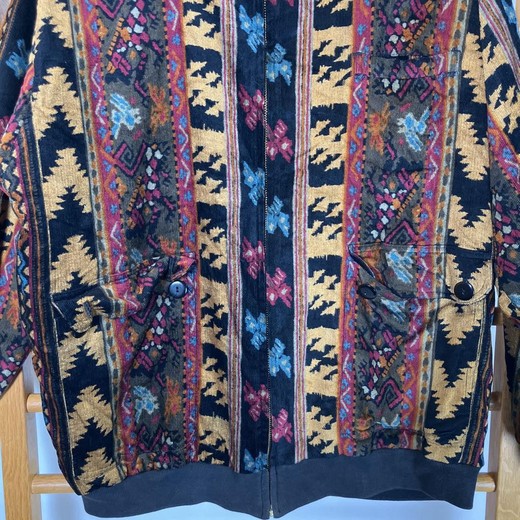 Colorful patterned jacket on a wooden rack