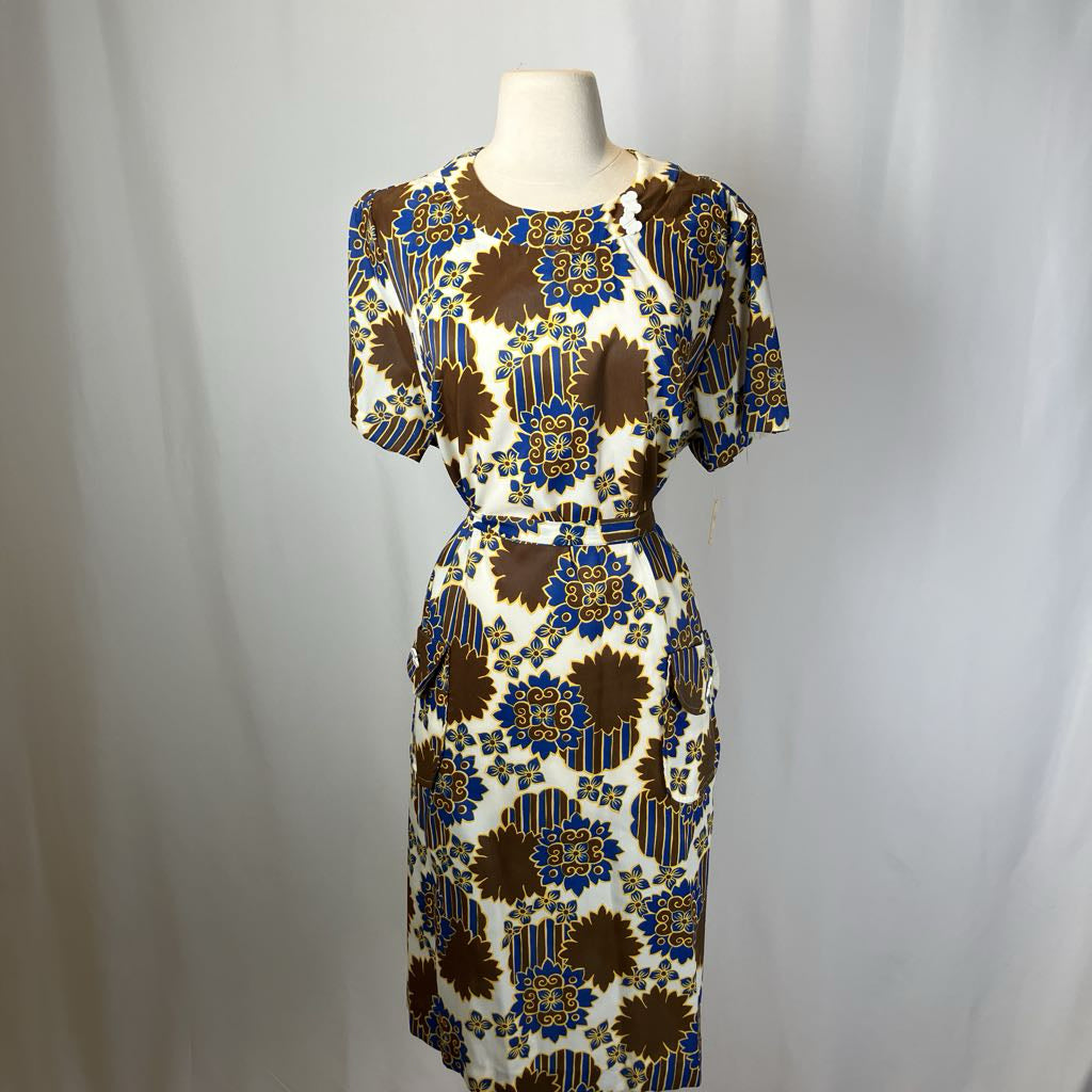 Patterned dress on a mannequin against a white background