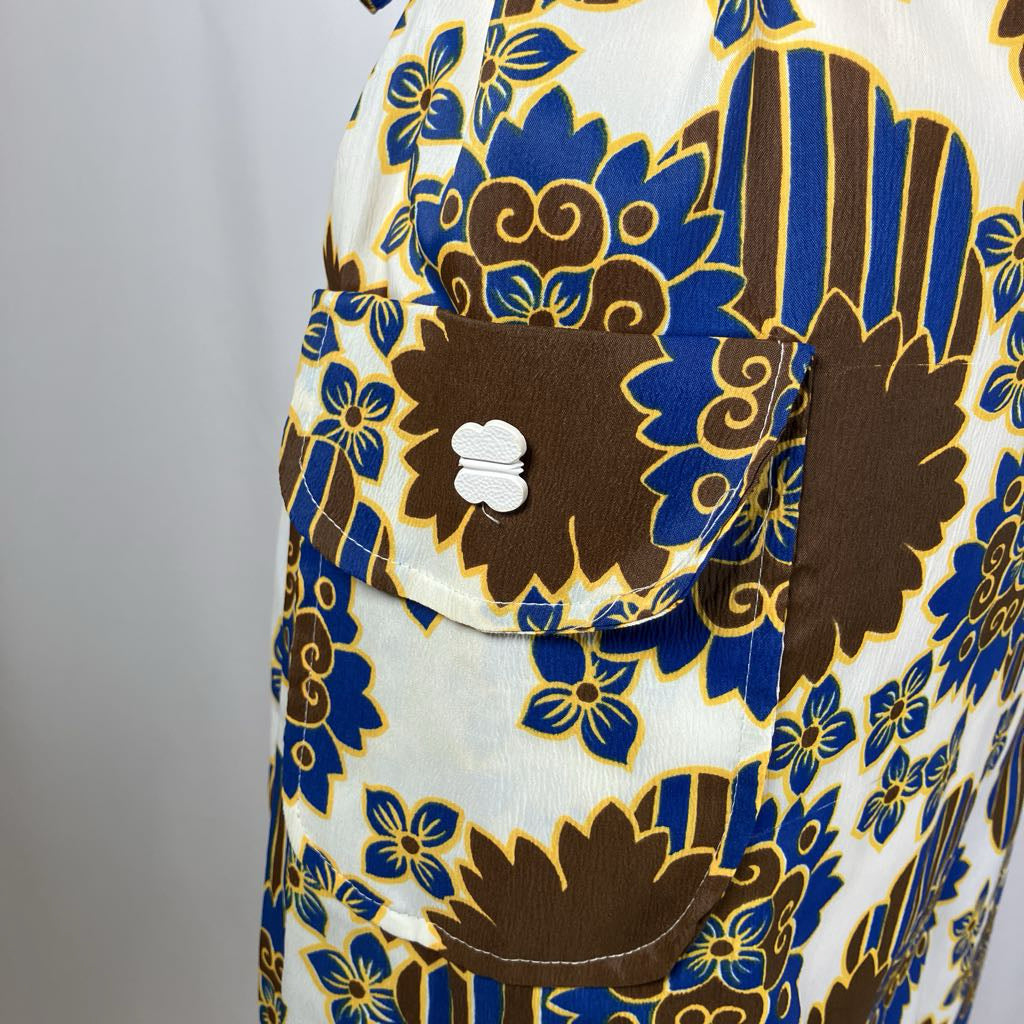 Patterned fabric with blue and brown floral design on a white background