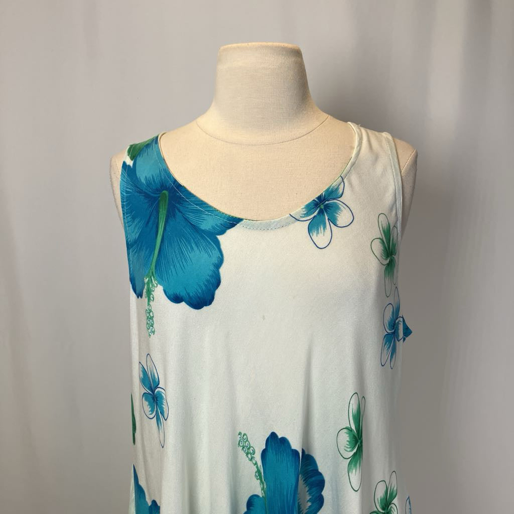 White sleeveless top with blue floral patterns on a mannequin against a plain background