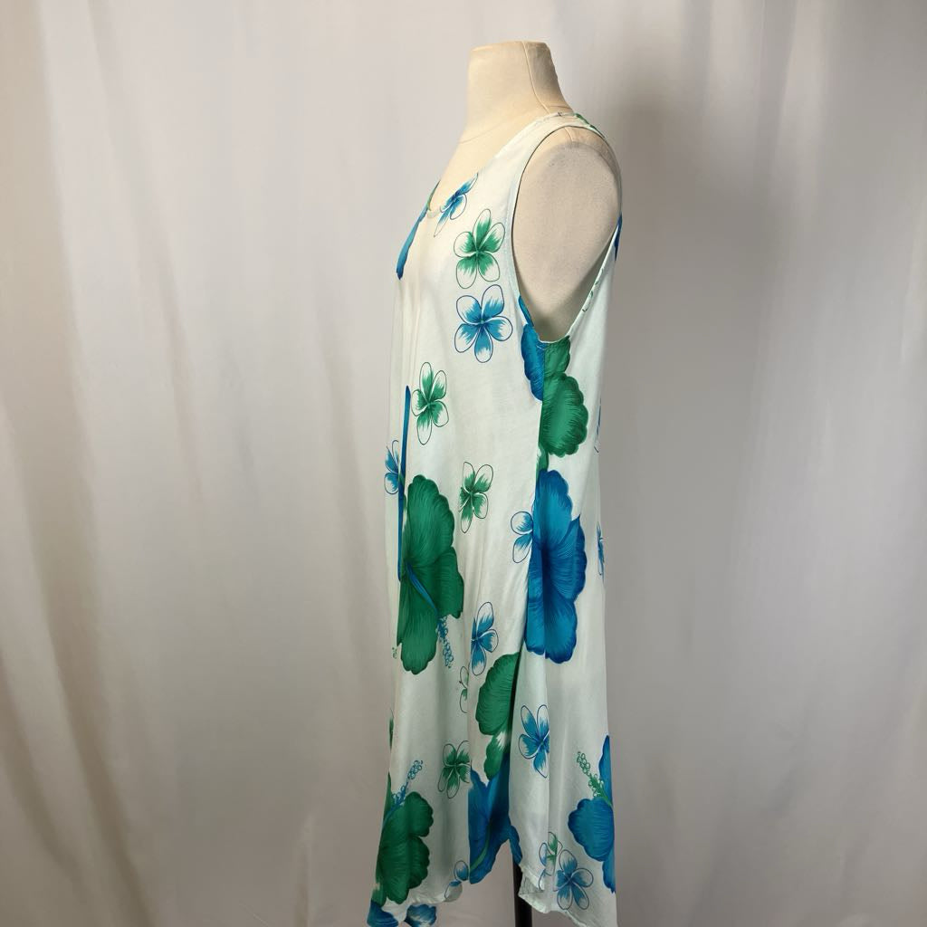 Mannequin wearing a sleeveless dress with blue and green floral pattern on a white background