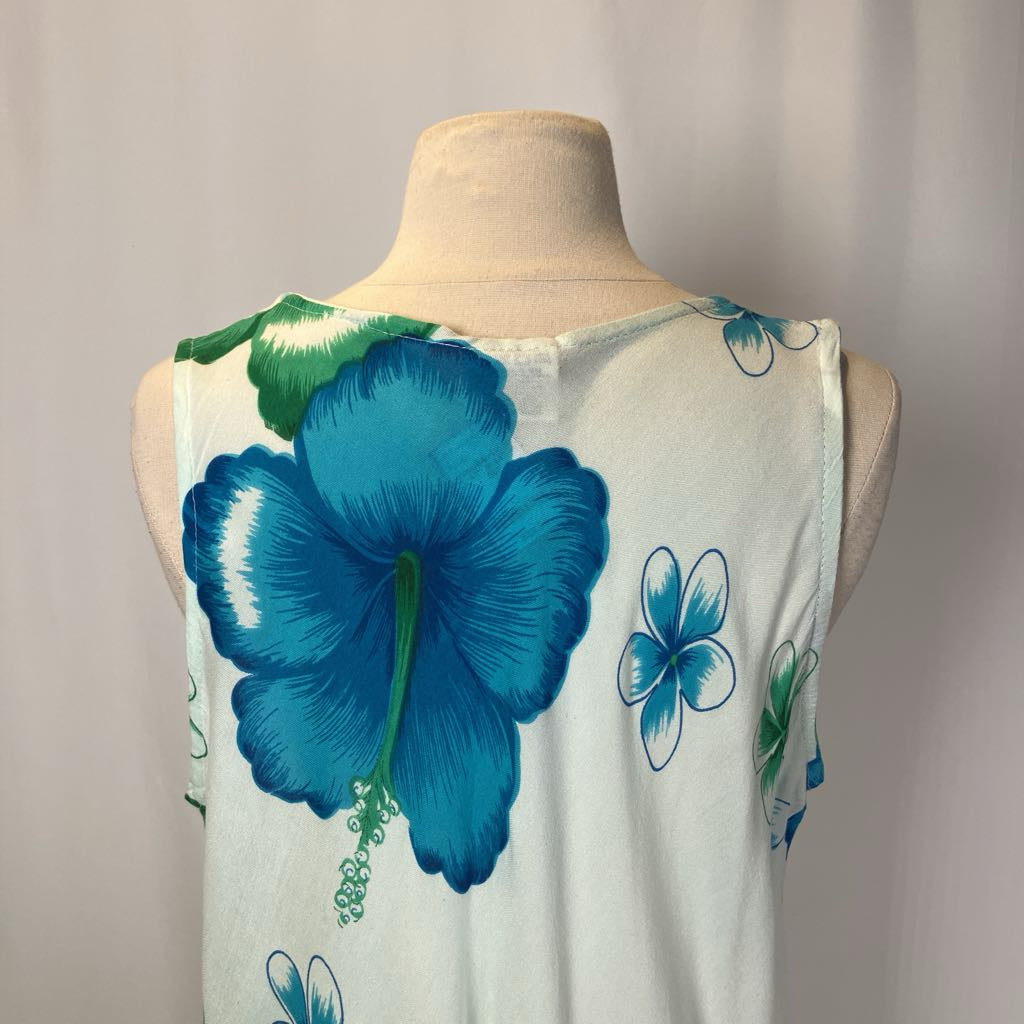 White sleeveless top with blue floral designs on a mannequin against a neutral background