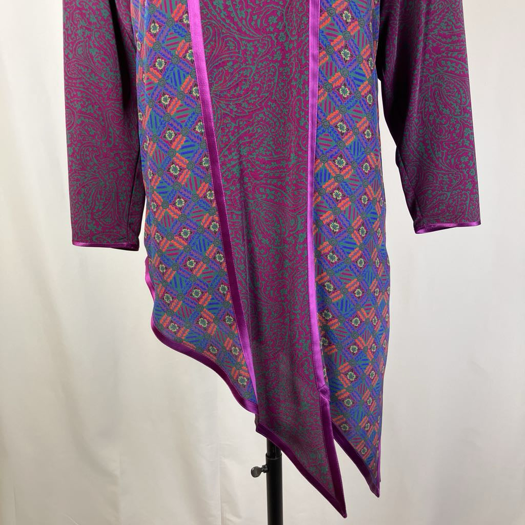 Purple patterned garment on a mannequin against a white background
