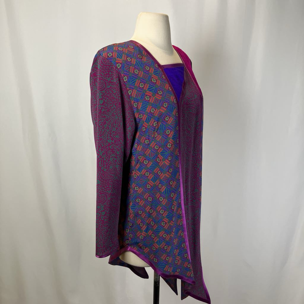 Mannequin wearing a patterned purple garment against a plain background