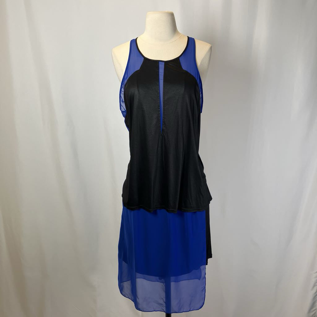Black and blue dress on a mannequin against a white background
