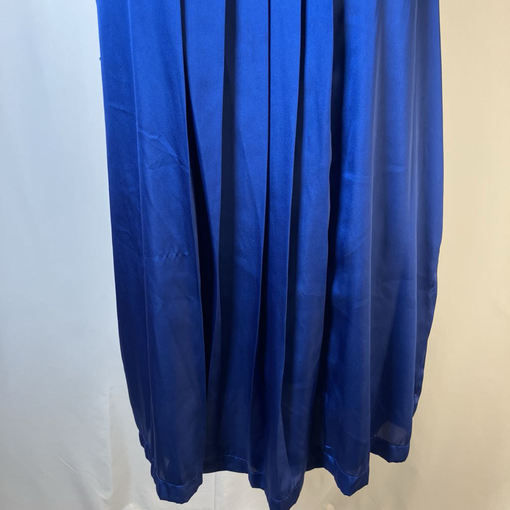 Blue curtain against a white wall