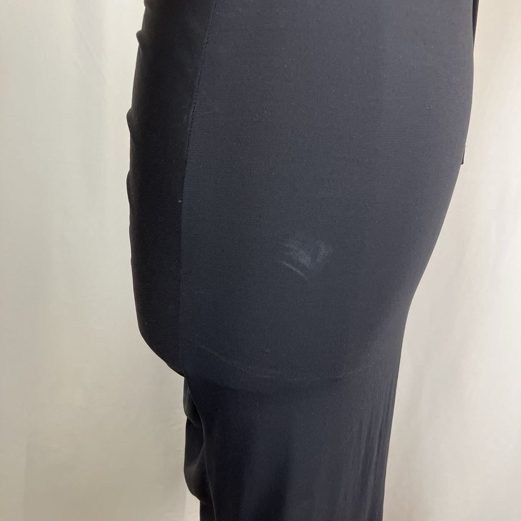 Dark gray leggings with a visible brand logo on a light background