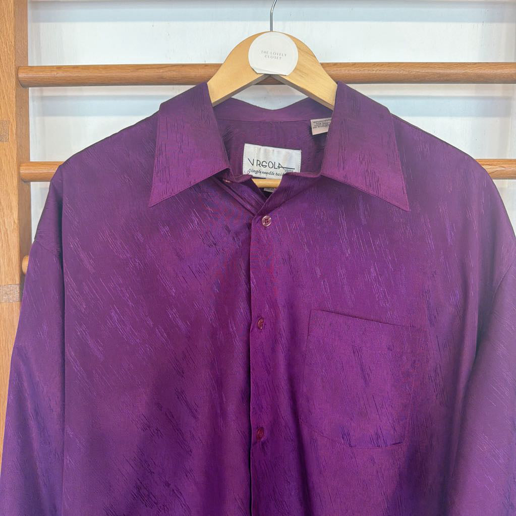Purple shirt on a hanger with a blurred background