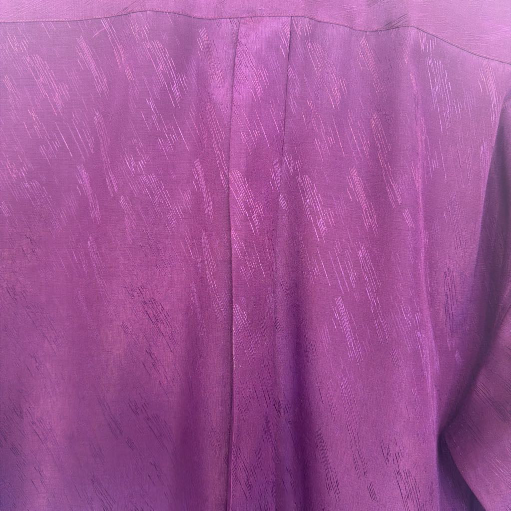 Close-up of purple fabric with a textured pattern