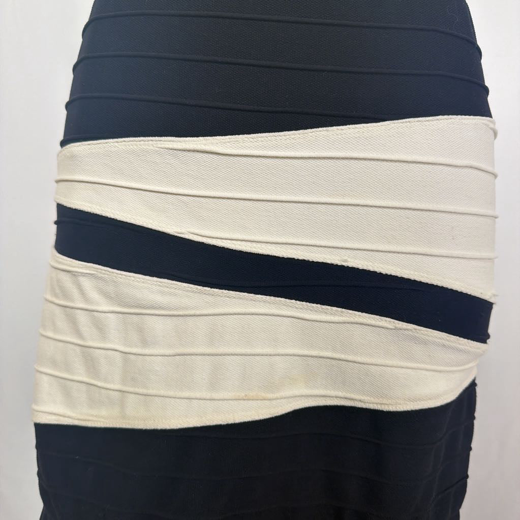 Black and white geometric patterned skirt on a mannequin in front of a white wall.