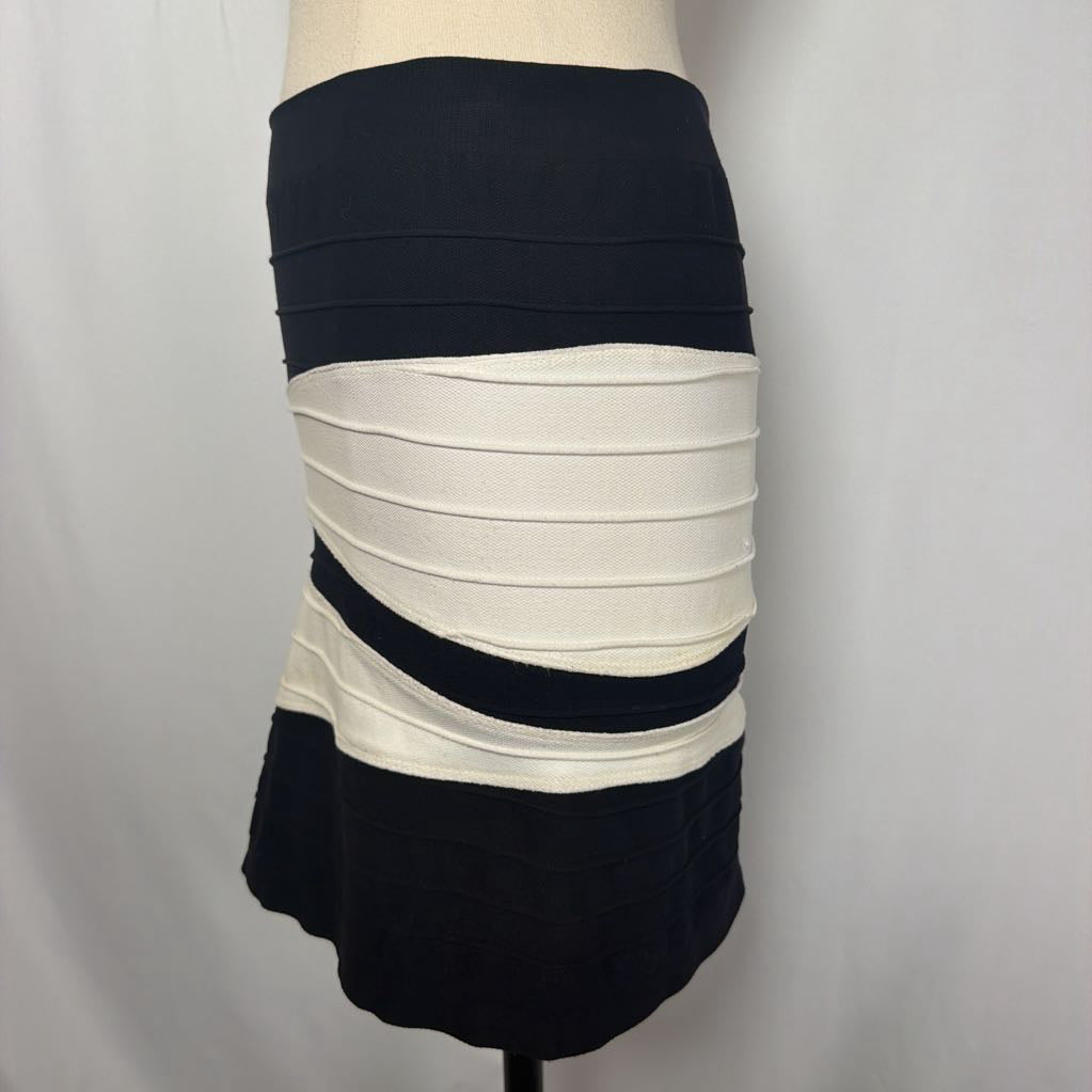 Black and white geometric patterned skirt on a mannequin in front of a white wall.