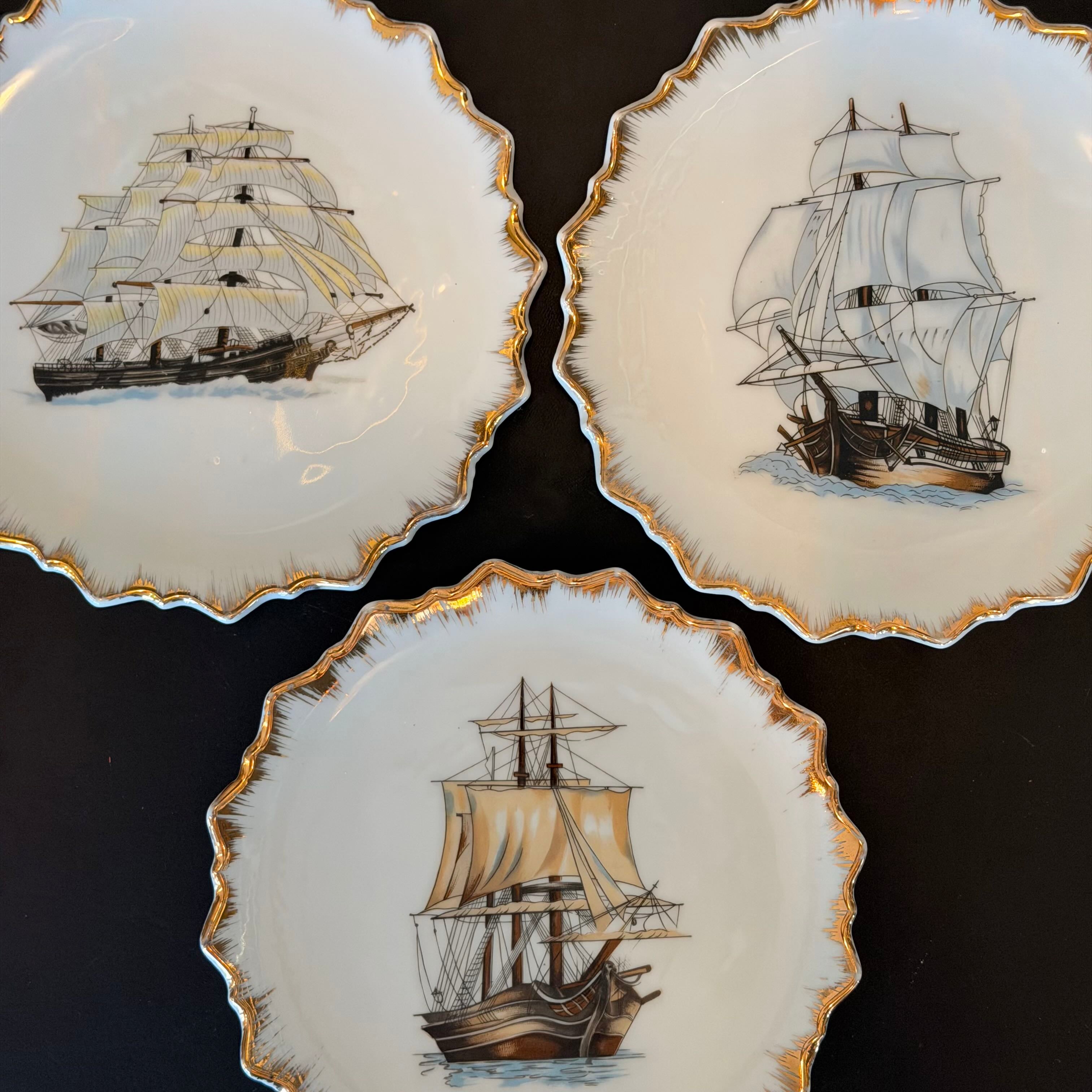 Three decorative plates with ship illustrations on a black background