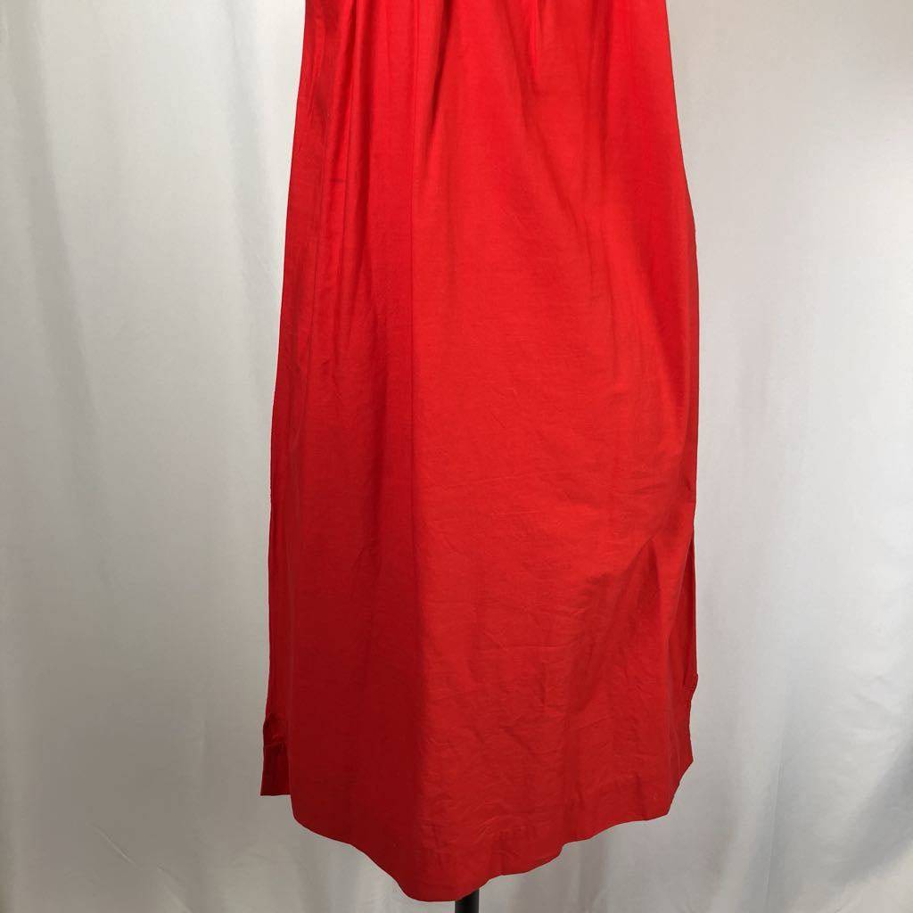 Red dress on a mannequin against a white background