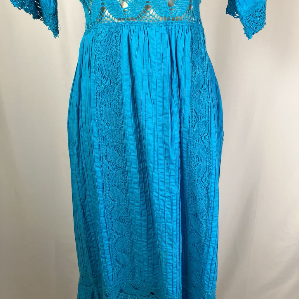 Blue lace dress on a plain background
