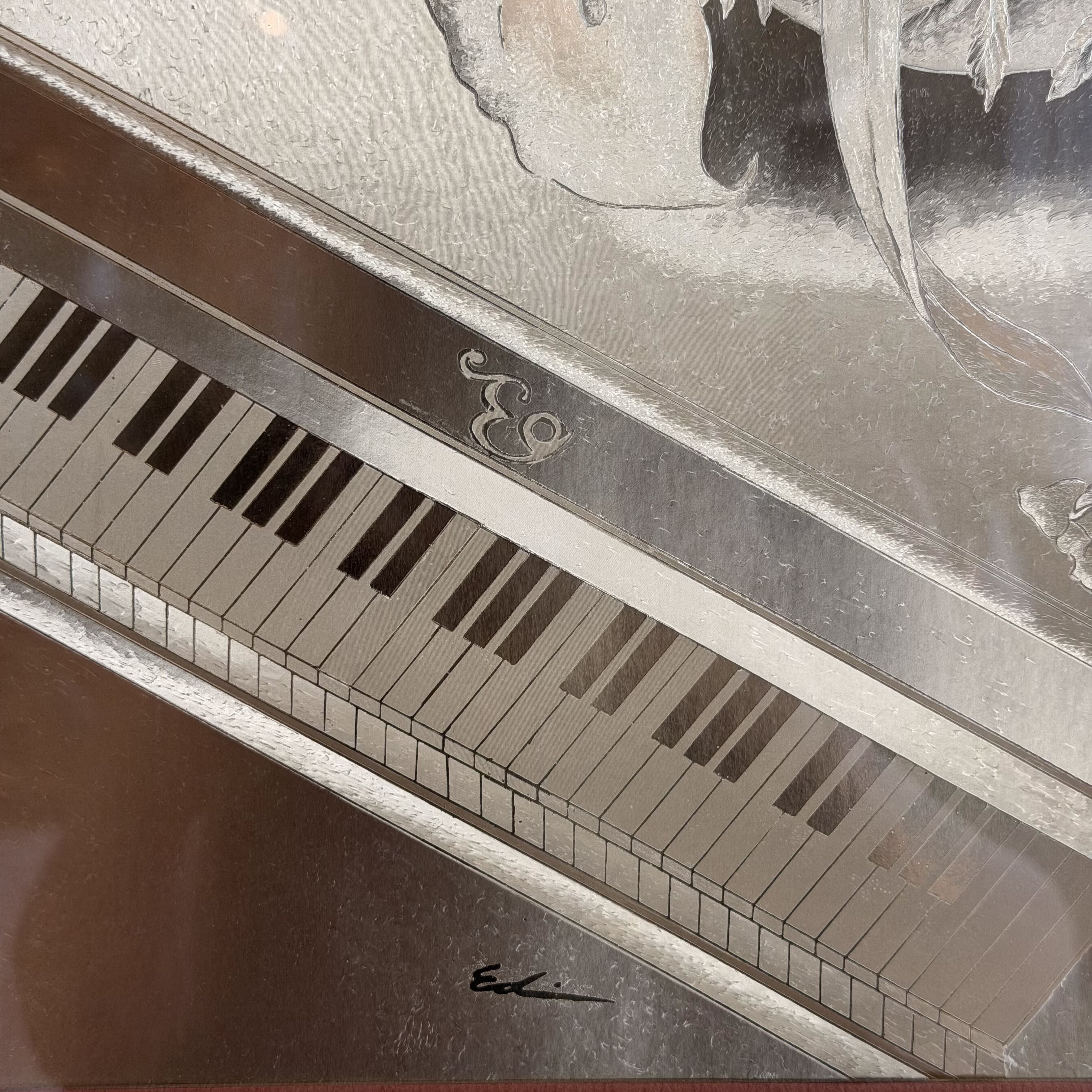 close up of art decor image of piano and signature