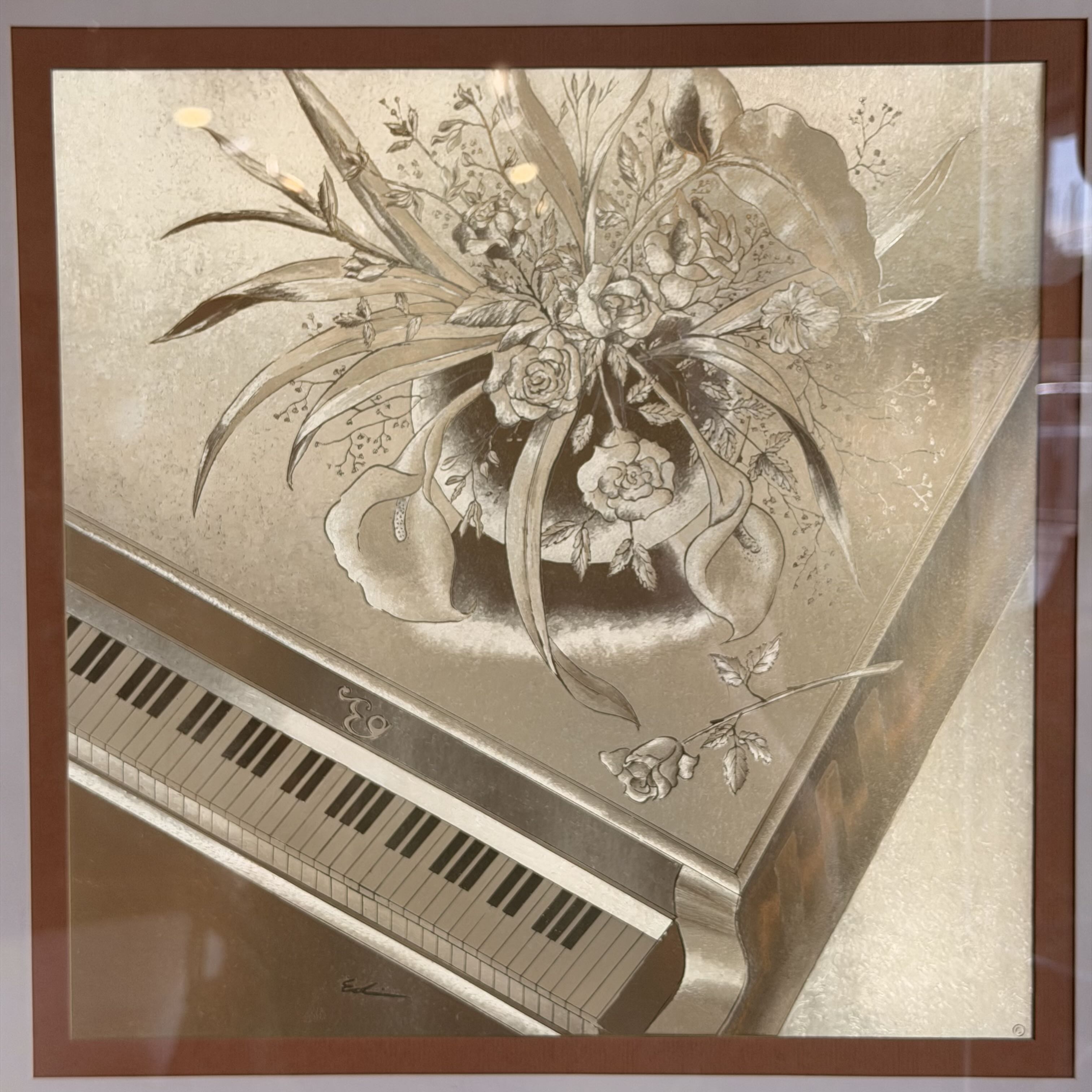 art decor of bronze gold piano with flowers on top