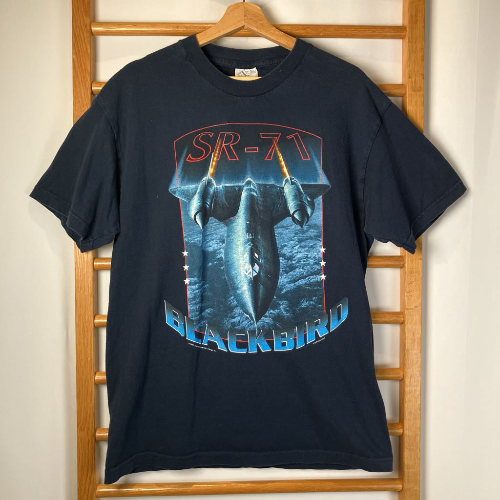 Black t-shirt with SR-71 Blackbird graphic on a wooden hanger