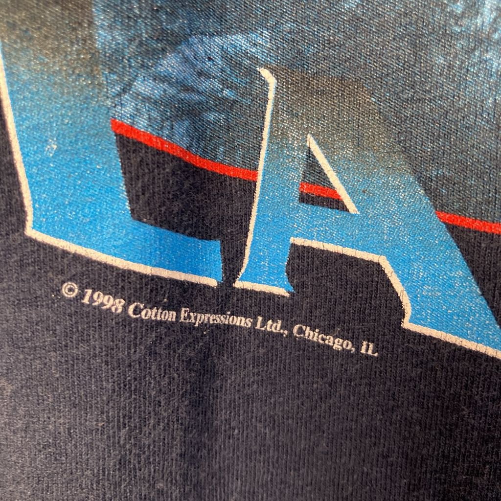 Close-up of a logo with 'Cotton Expressions Ltd.' text on a textured surface.