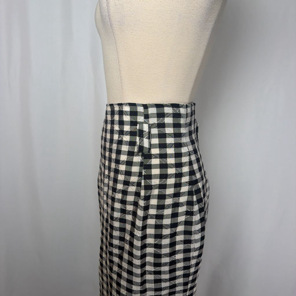 Black and white gingham skirt on a mannequin front of a white wall.