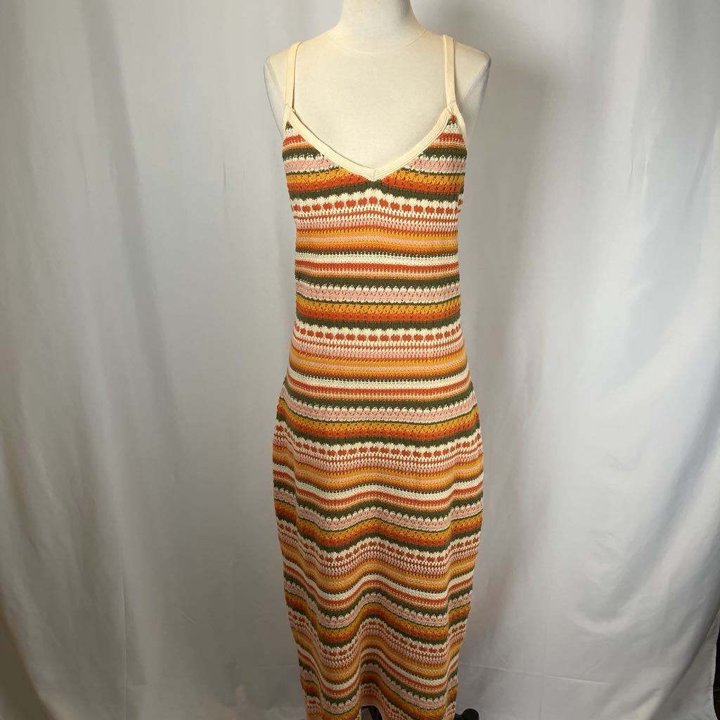 Striped dress on a mannequin against a plain background
