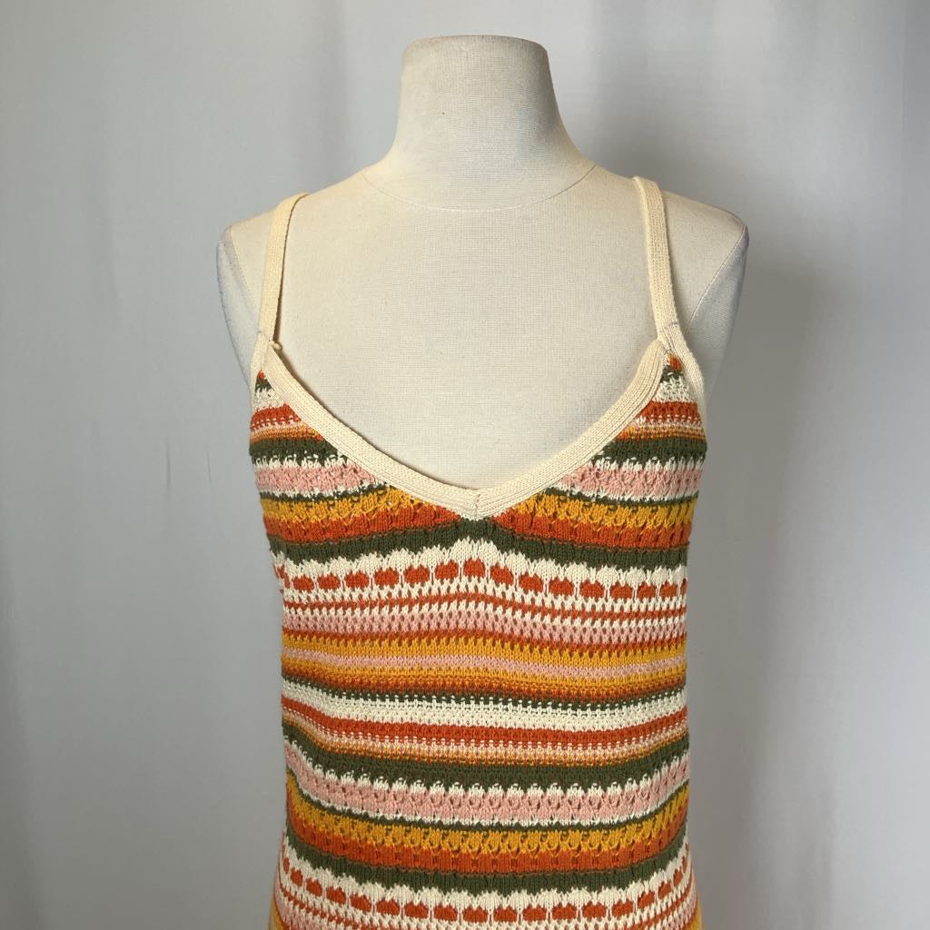 Colorful striped tank top on a mannequin against a plain background