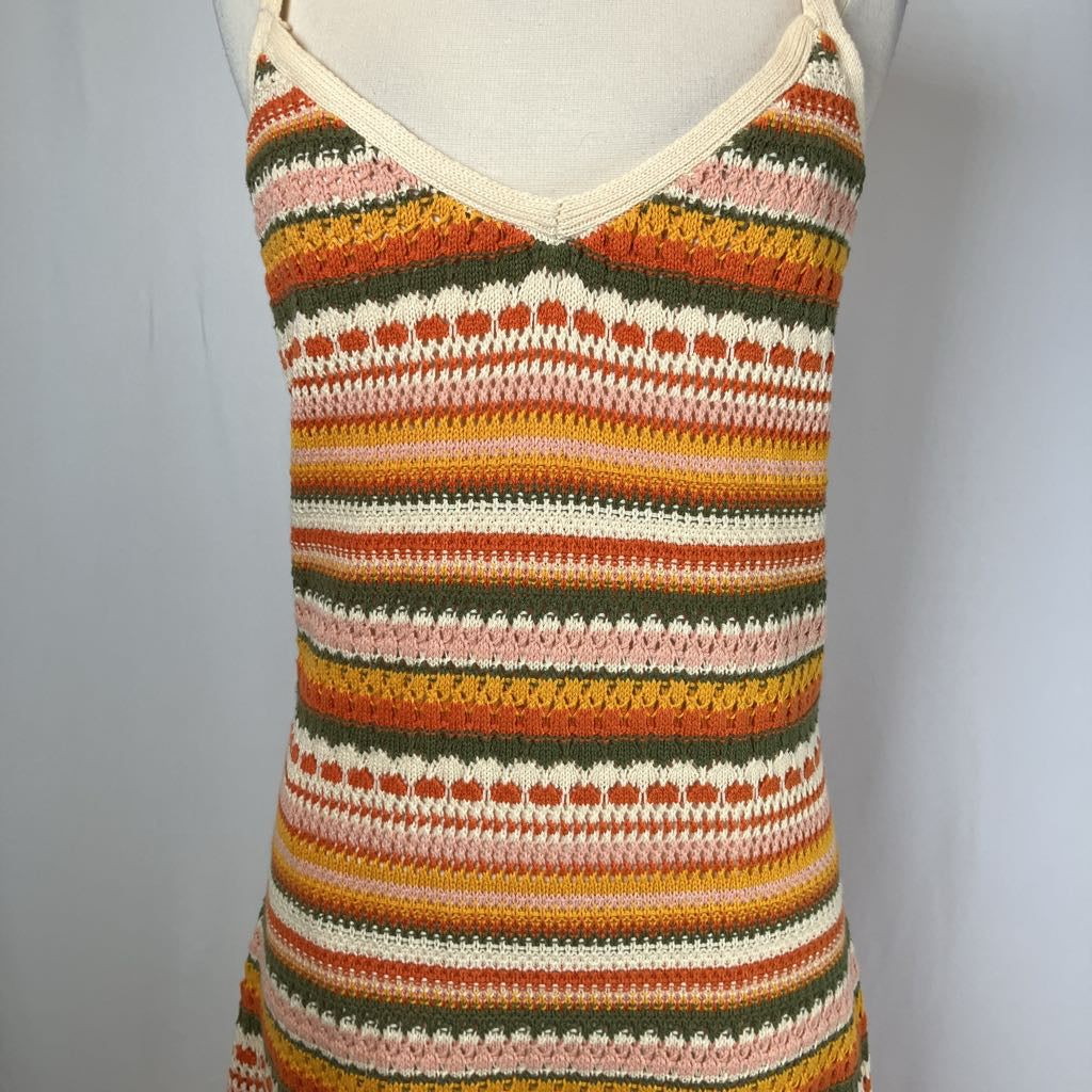 Multicolored striped tank top on a mannequin against a plain background