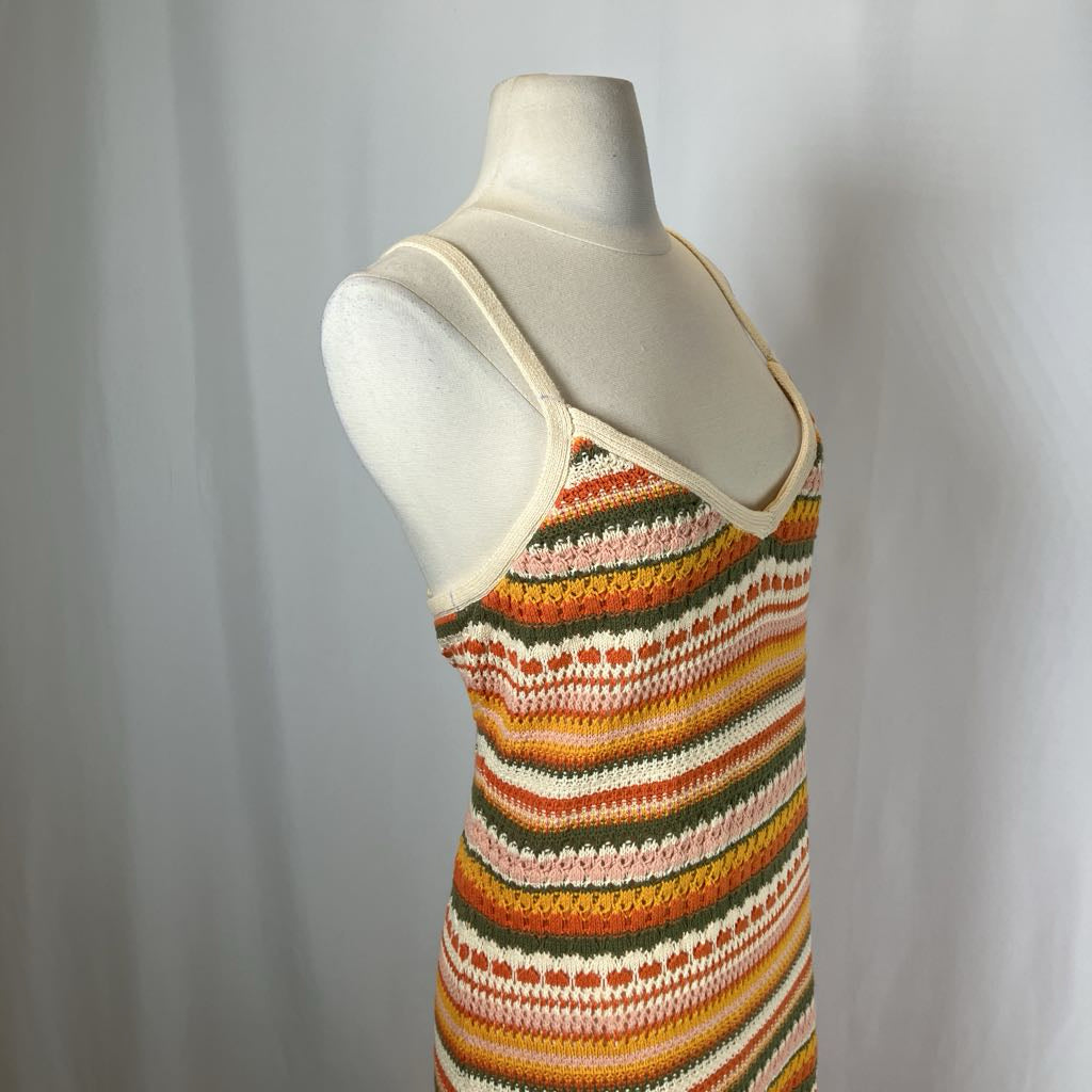 Colorful striped tank top on a mannequin against a plain background