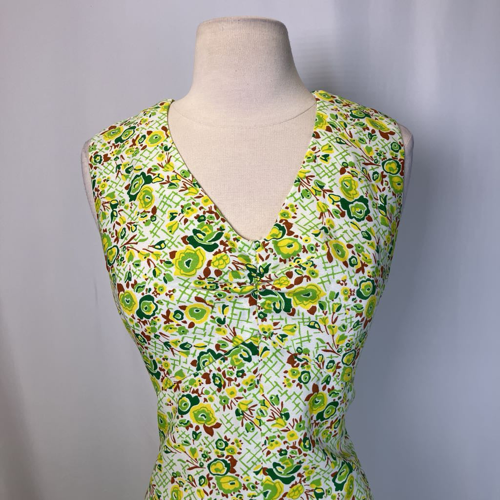 Close up of the neckline of dress on simple background