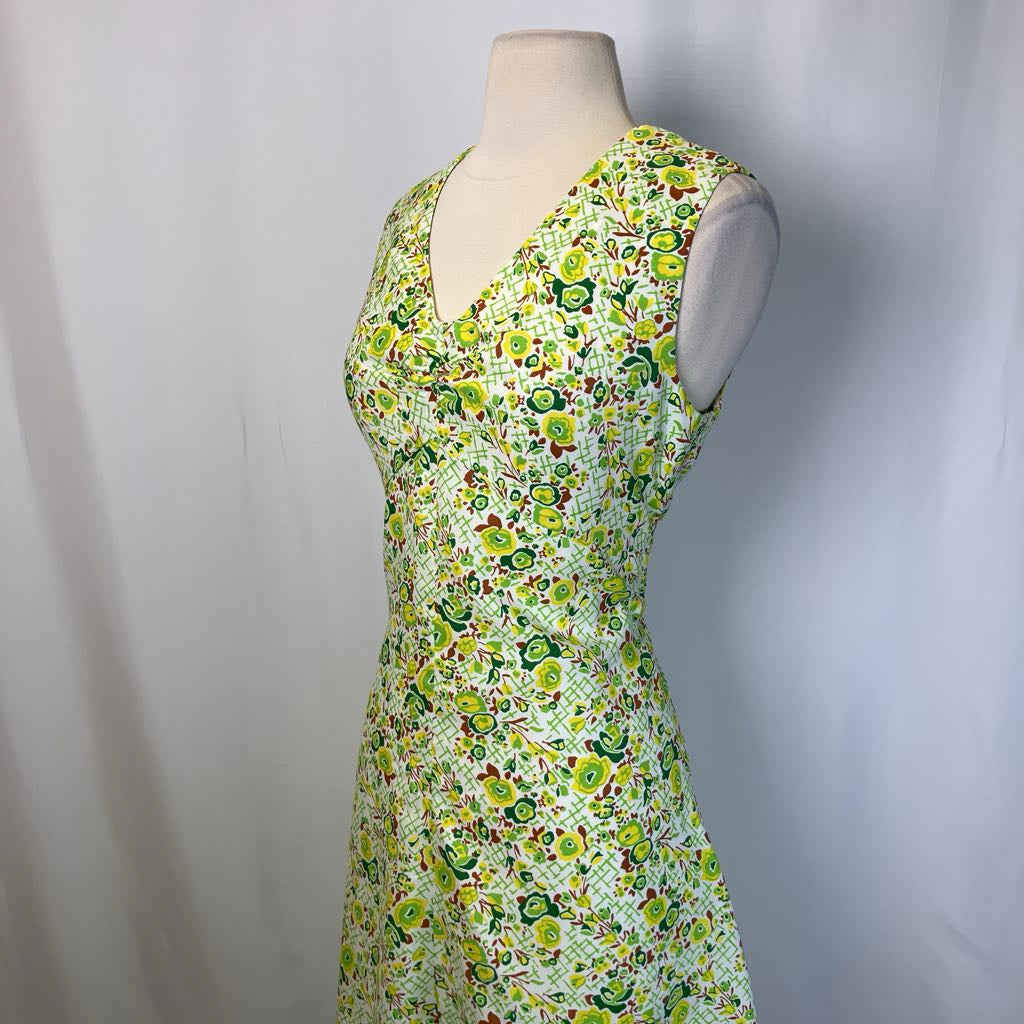 Floral dress on mannequin with simple background