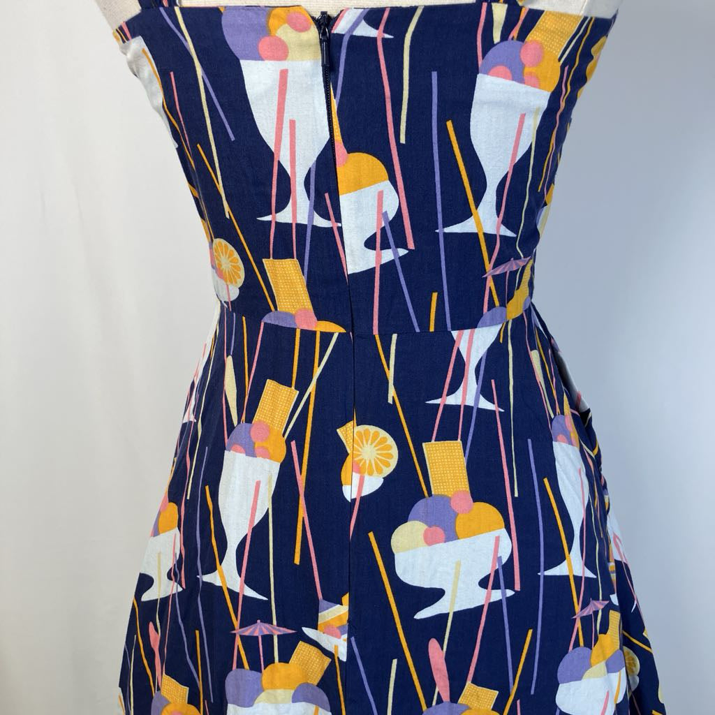 Closeup of the waist on the back of the dress with white background
