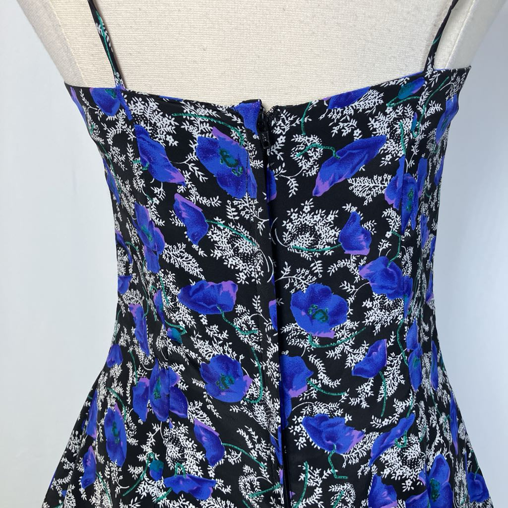 Close up of the back of the dress on simple white background
