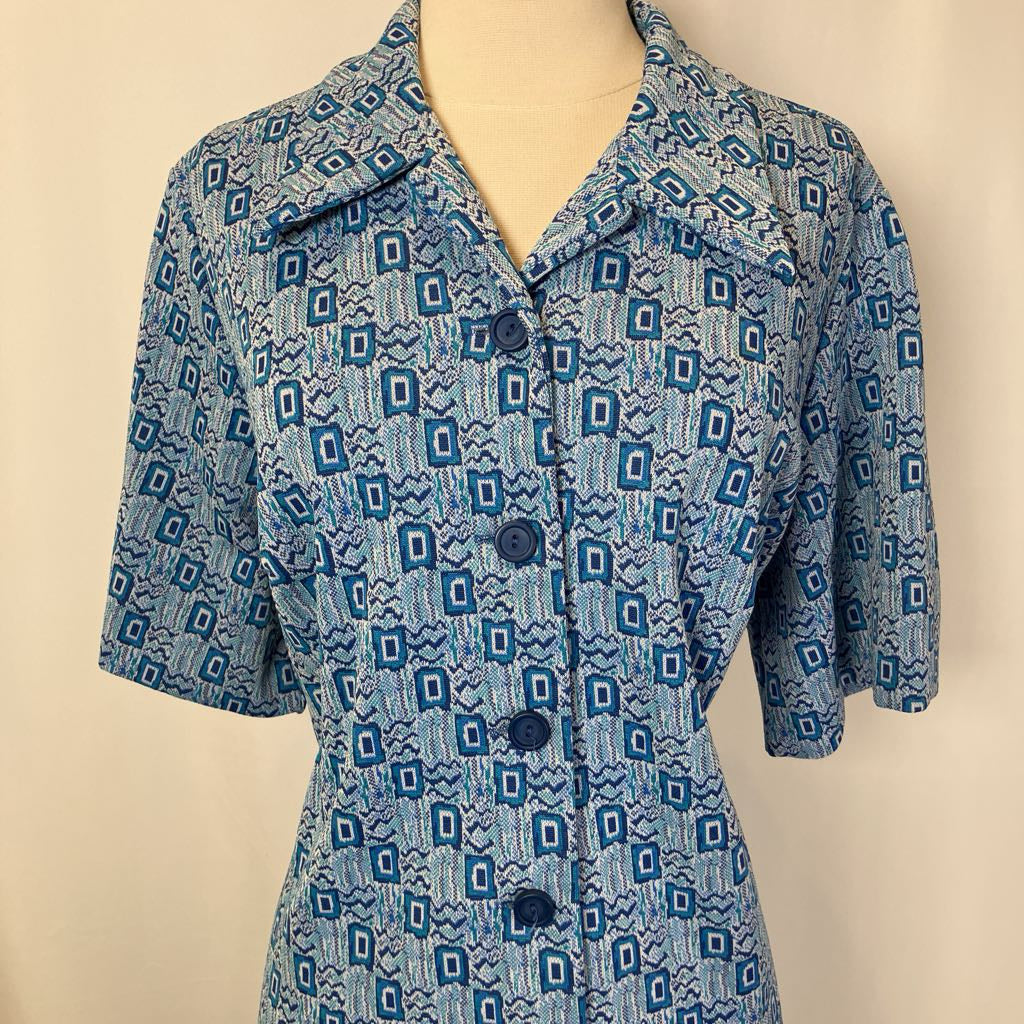 Close up of the top of the dress with blue and white geometric design