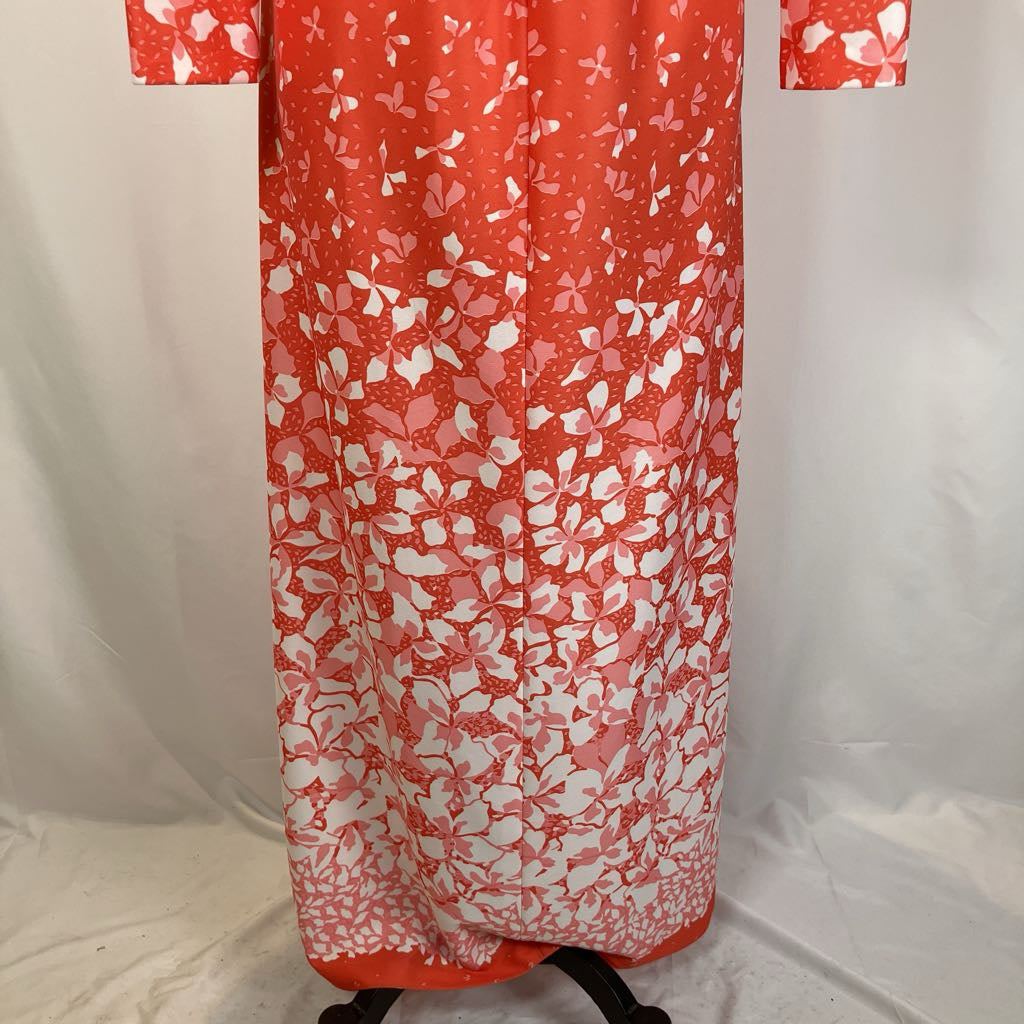 Closeup of the bottom of the dress with white floral motifs