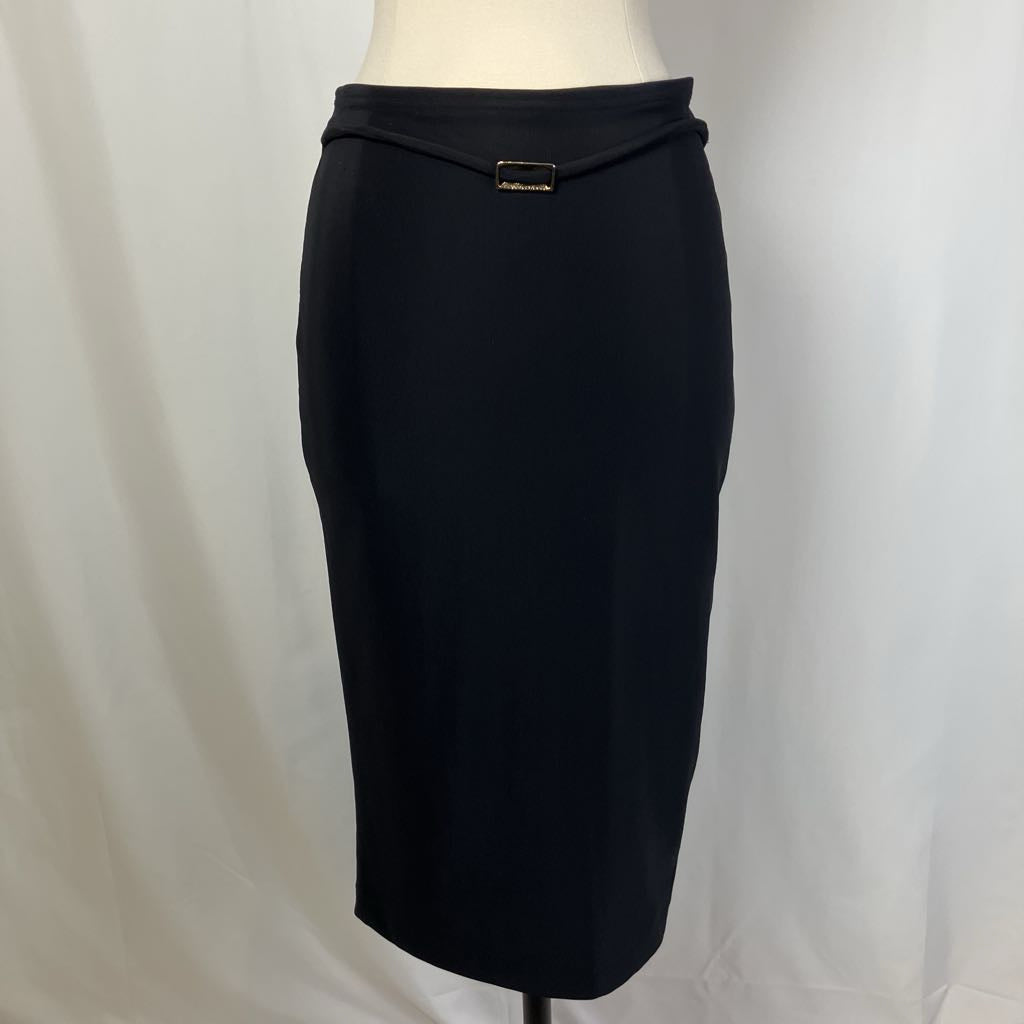 Black pencil skirt on a mannequin against a plain background