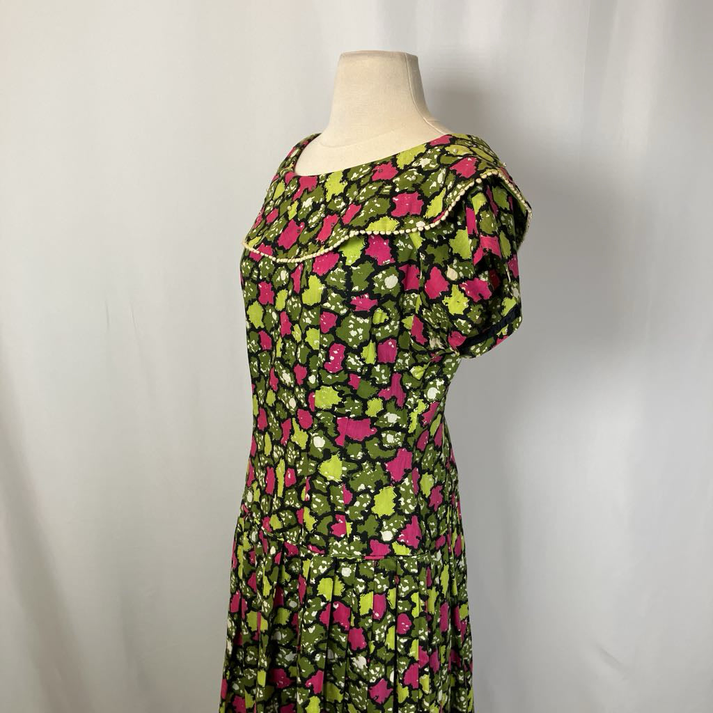 Floral dress on a mannequin against a plain background