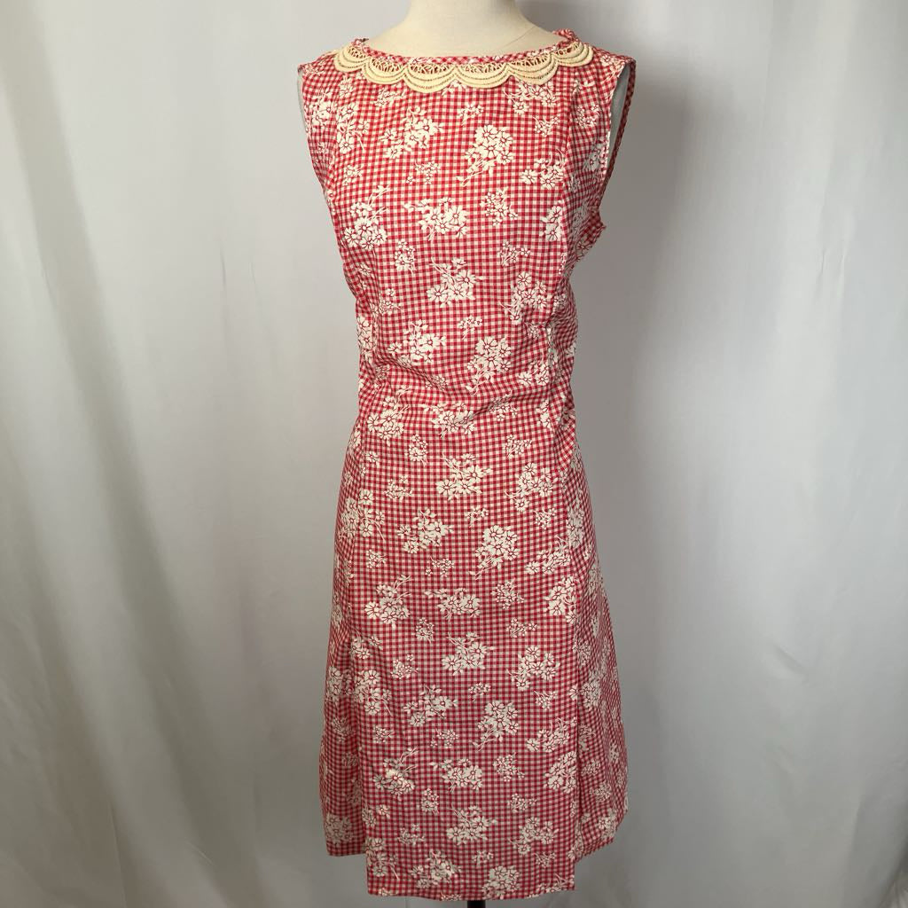 Red checkered dress with floral patterns on a white background