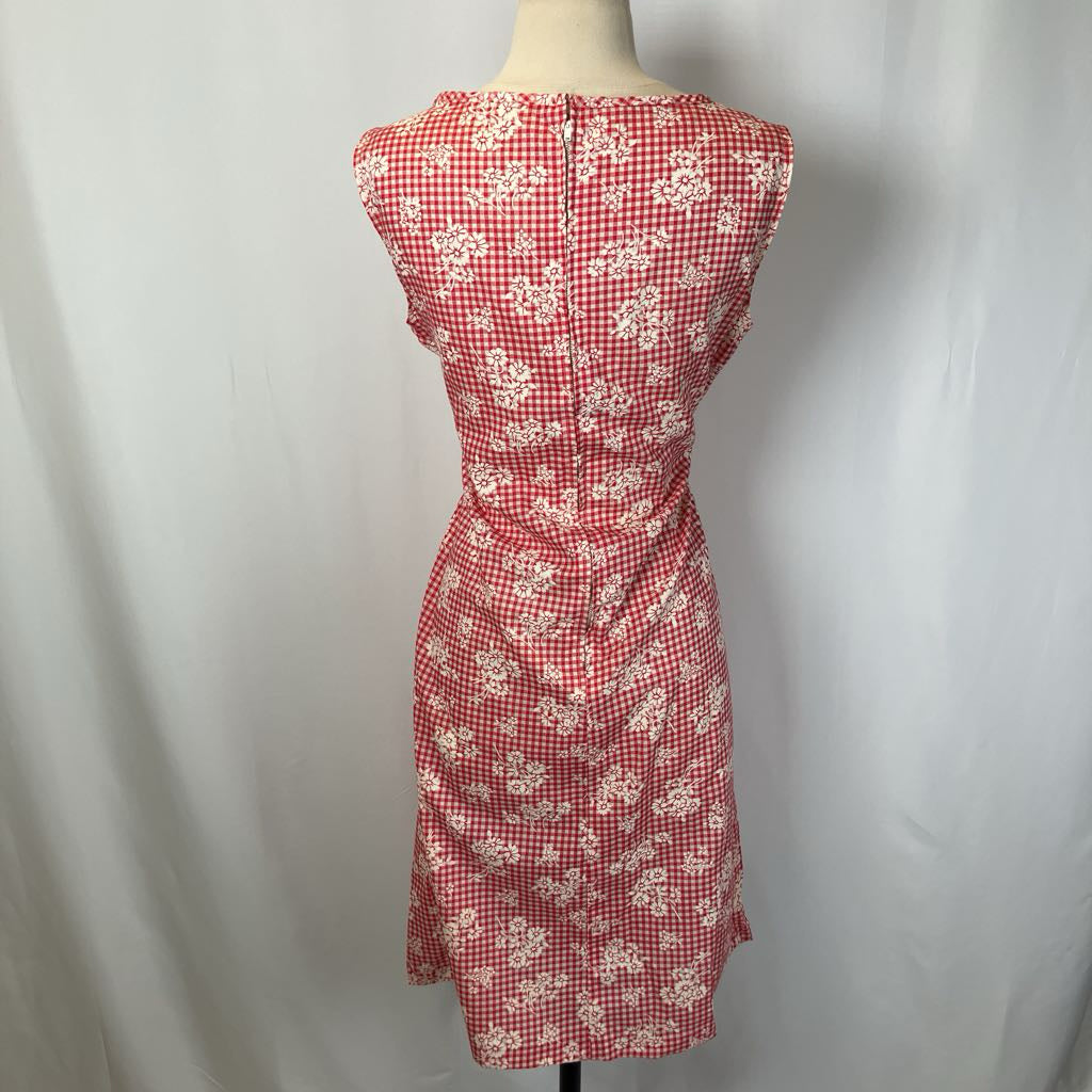 Red checkered dress with floral pattern on a mannequin against a white background