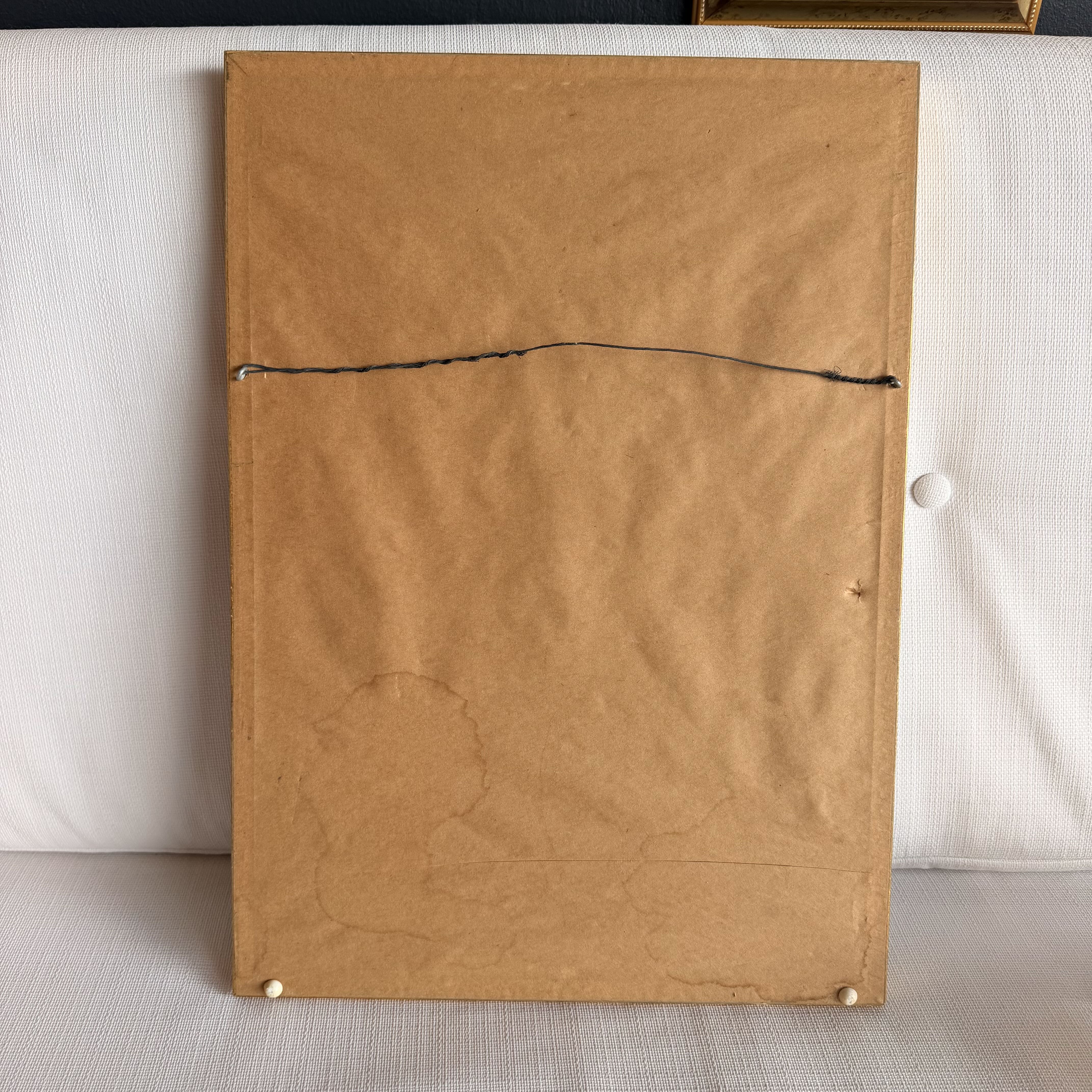 back of painting on a white surface