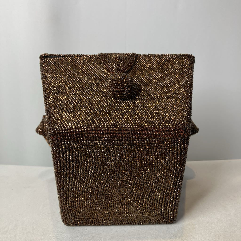 Brown beaded handbag on a light gray background