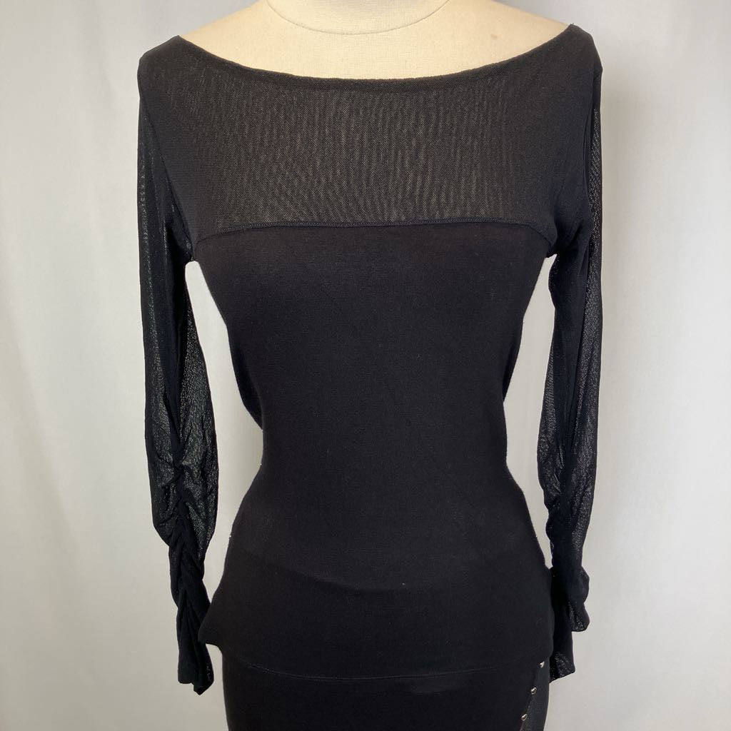 Black long-sleeve top on a mannequin against a plain background