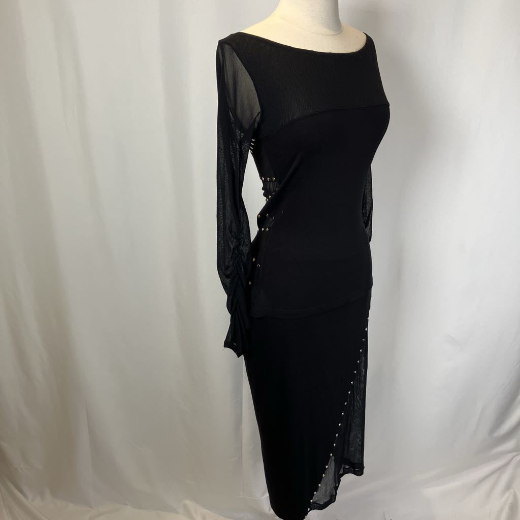 Black dress with sheer sleeves on a mannequin against a white background