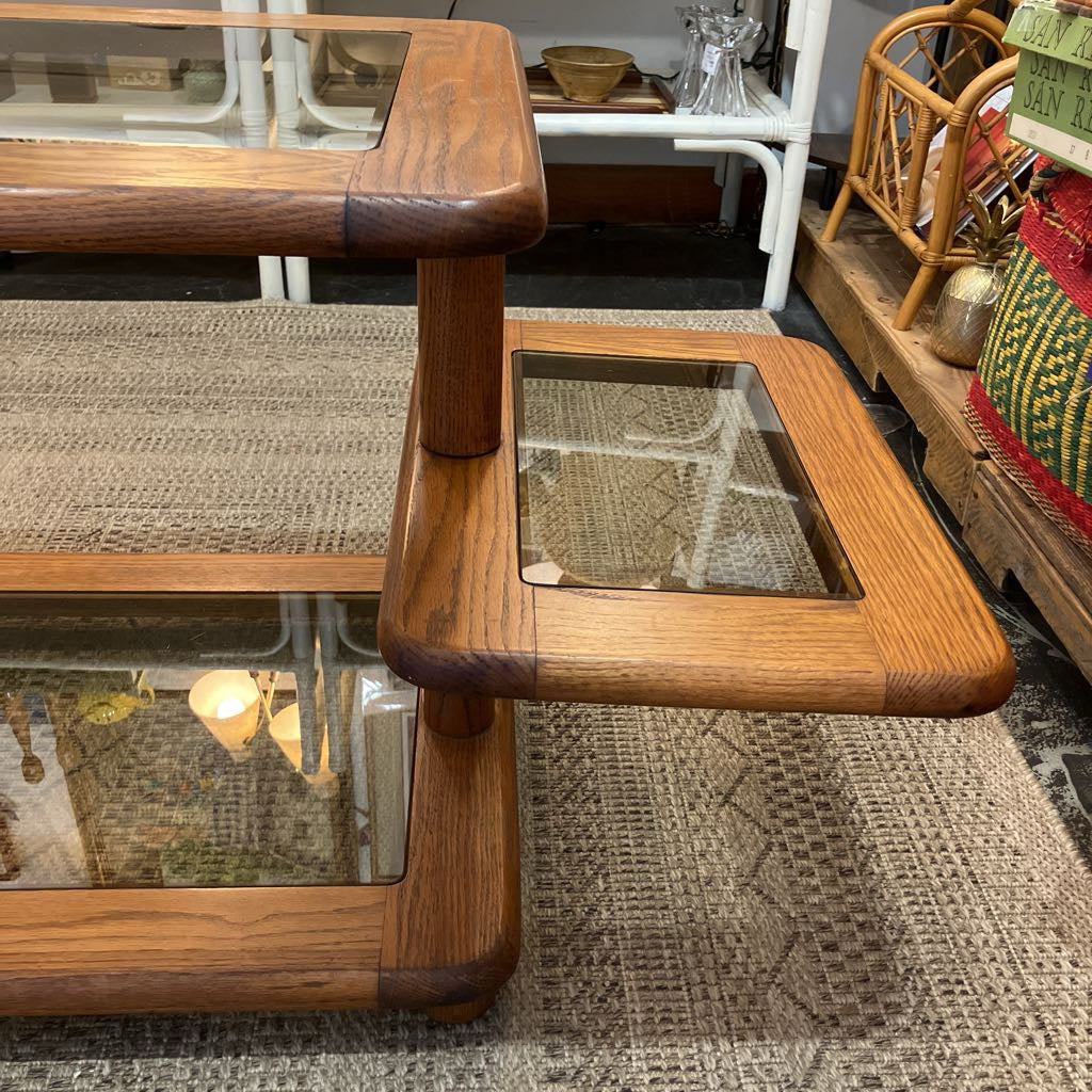 Wooden coffee table with glass top in a room setting
