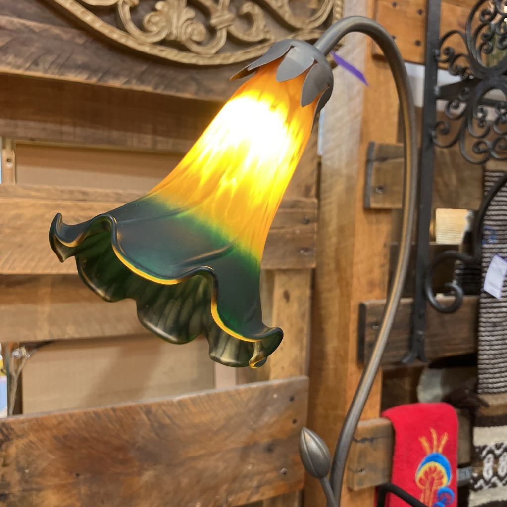 Decorative lamp with a floral design on a wooden background